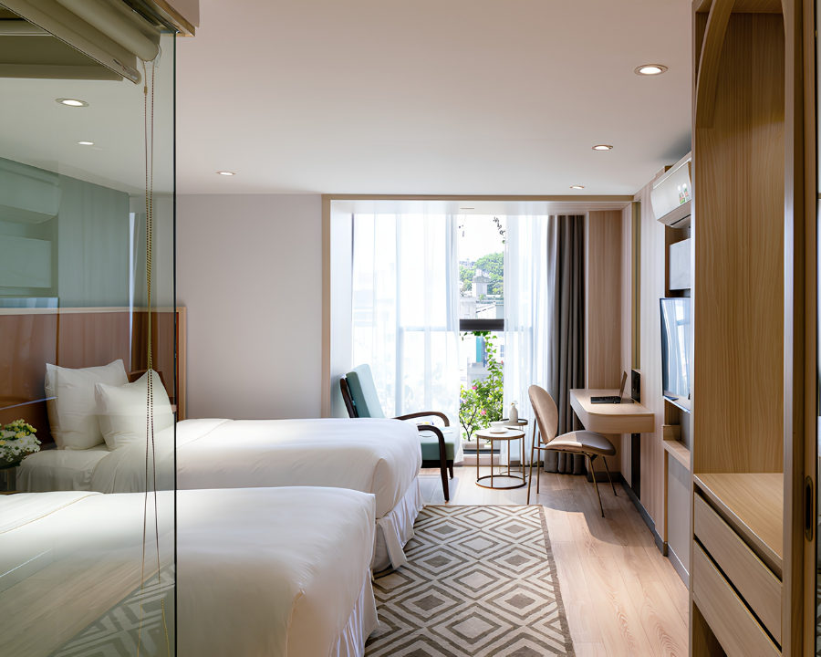 Le Jardins twin room with natural light.